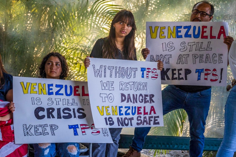 People with signs.