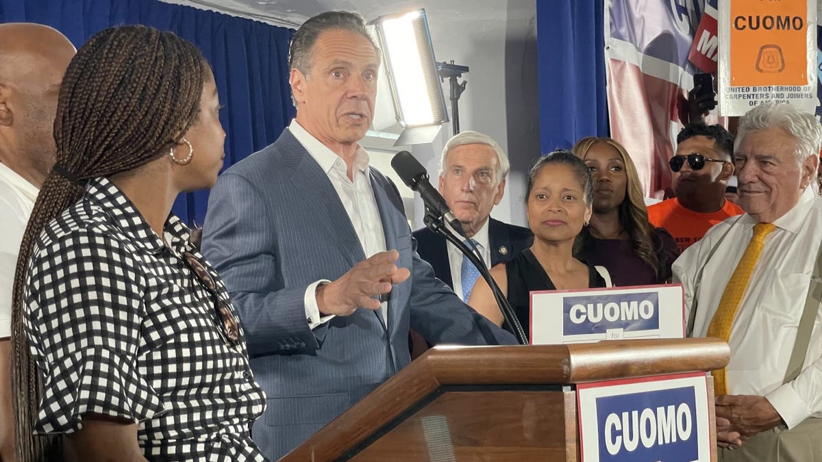 cuomo with others at lectern