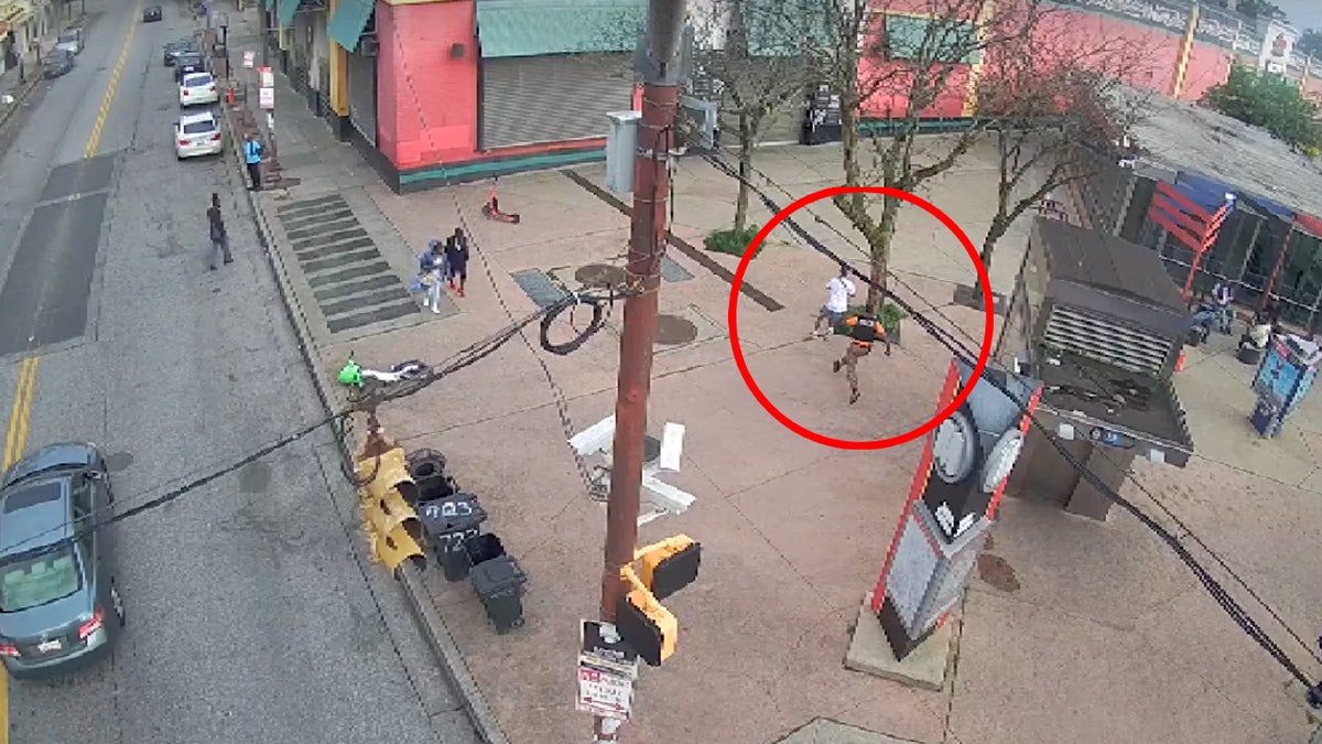 Footage captures a detective chasing after the suspect after the suspect did not listen to police officer's commands.