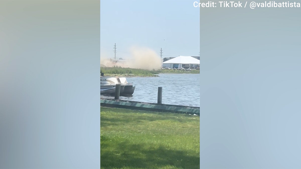 A helicopter dramatically crashed near a Michigan waterfront restaurant on Sunday,