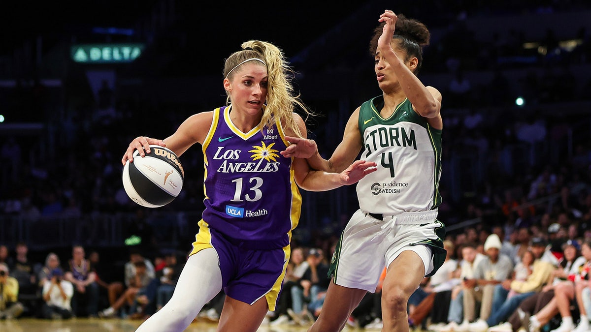 Sarah Ashlee Barker dribbles ball